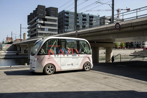 In this Sept. 9, 2016 file photo, the driverless electric free shuttle Navly drives through a district of Lyon, central France, as part of an experiment. Paris officials are experimenting with a self-driving shuttle linking two train stations in the French capital. Two electric-power EZ10 minibuses, which can carry up to six seated passengers, were put into service Monday, Jan. 23, 2017. (AP Photo/Laurent Cipriani, File)
